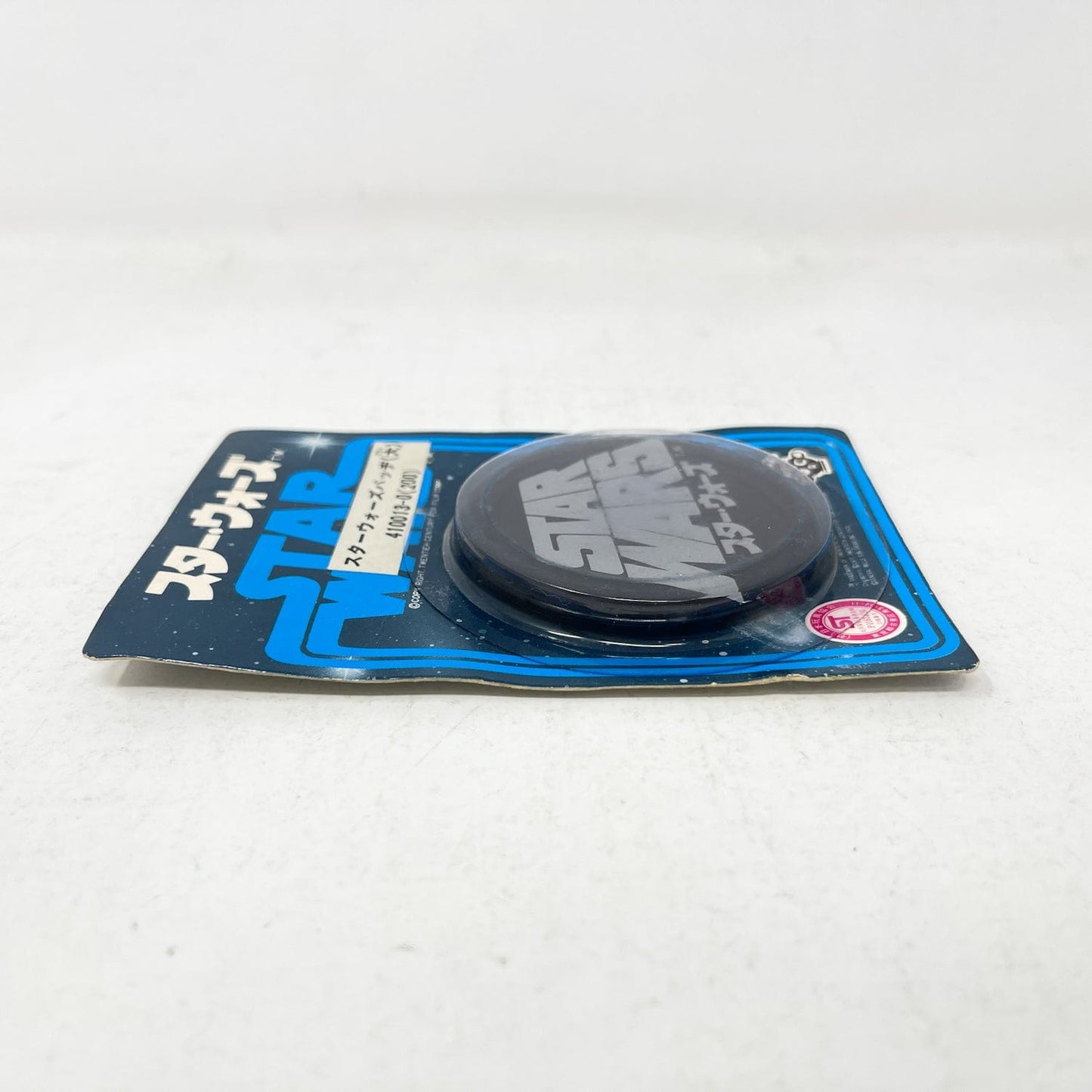 Vintage Factors Star Wars Non-Toy Takara Star Wars Logo Button - Black Mint in Package