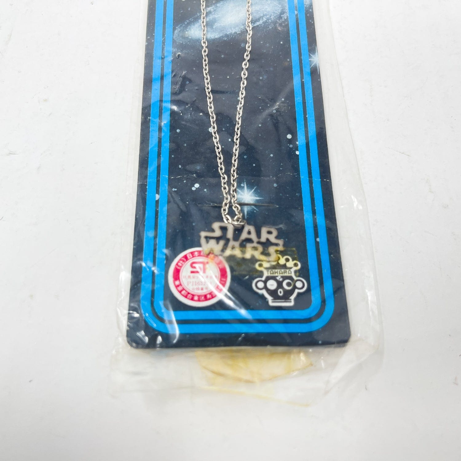 Vintage Factors Star Wars Non-Toy Takara Star Wars Logo Necklace - Mint in Package